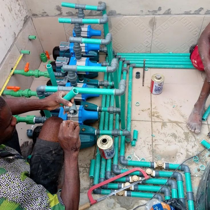 Water pumps and manifold piping system neatly installed by KIKA'S Plumbing